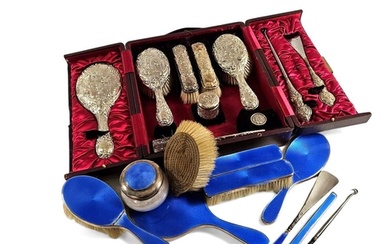 An Edwardian hallmarked silver dressing table set comprising...