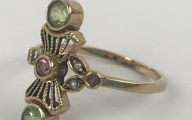 An Edwardian style 9ct gold, green, red and white stone rin...