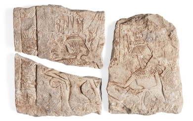 An Egyptian style limestone relief, with Tutankhamun seated on his throne wearing the atef crown and broad collar seated in a throne attended by his wife-sister with Queen Ankhesenamun wearing a crown, cartouches in the field, a column on the left...