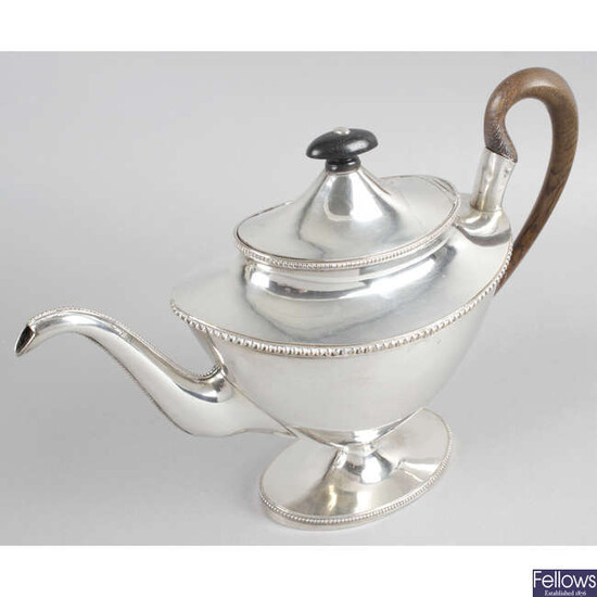 An Old Sheffield plate teapot of vase shape, together with two silver plated coffee pots. (3).