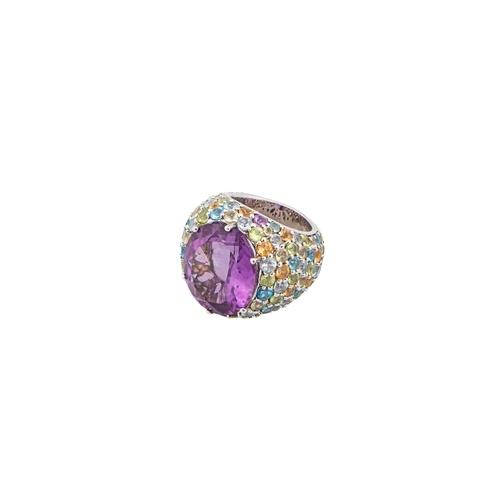 An amethyst and multi gem set bombe dress ring The large cen...