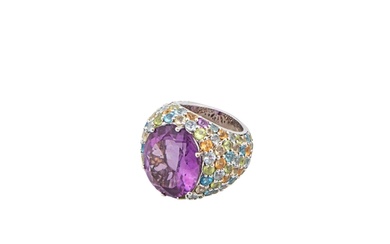 An amethyst and multi gem set bombe dress ring The large cen...