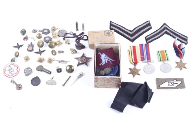 An assortment of WWII and later British and US military medals, patches, etc.