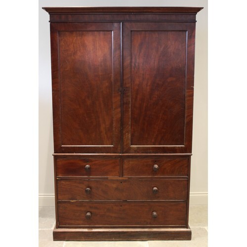 An early 19th century mahogany linen press, with a cavetto c...