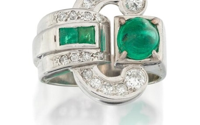 An emerald and diamond dress ring, of stylised buckle design set to one side with a single sugar loaf emerald with pave diamond scrolls and opposing diamond and calibre emerald detail, stamped 750, approx. ring size N