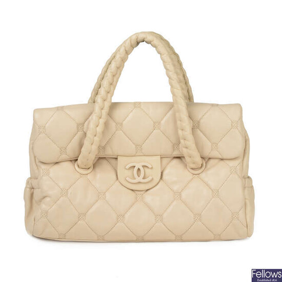 CHANEL - a pale quilted leather Hidden Chain handbag.