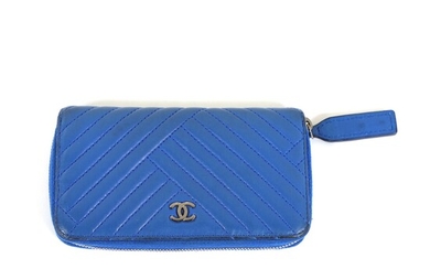 NOT SOLD. Chanel: A wallet made of blue leather with silver toned hardware, four card...