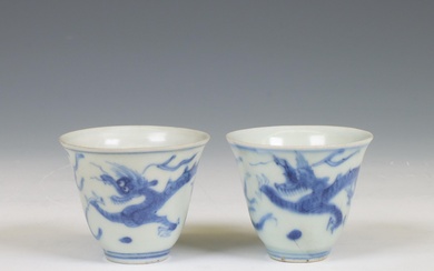 China, a pair of blue and white porcelain 'Hatcher Cargo' 'dragon' wine cups, circa 1640