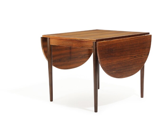 NOT SOLD. Danish furniture design: A Brazilian rosewood dining table with two foldable D-ends. H....