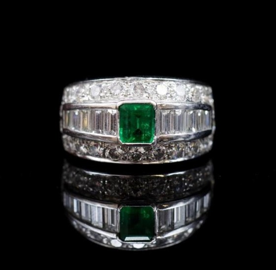 Emerald and diamond set 18ct white gold ring by Musson. Appr...