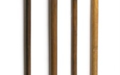 FOUR CANES Two with swirled glass handles, one with a mother-of-pearl flattened ball handle, and one with wooden handle carved in th...