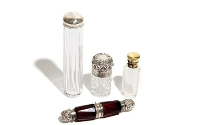 FOUR GLASS AND SILVER TOILETTE BOTTLES