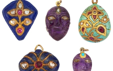 Five Indian gem-set pendants: two composed of carved amethyst masks embelished with lasque-cut diamonds, seed pearls and turquoise; two composed of lapis lazuli plaques embelished with lasque-cut diamonds and cabochon rubies; and one composed of...