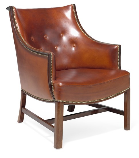 Frits Henningsen: Easy chair with mahogany frame. Sides, seat and back upholstered with cognac coloured leather, fitted with brass nails.
