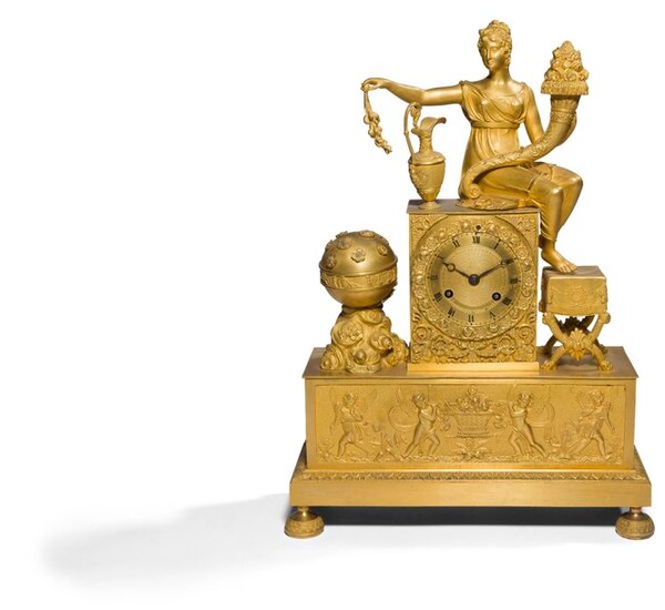 Gilt bronze clock decorated with a woman draped in Antique style holding a horn of plenty, her feet resting on a curved stool, the base with a frieze of winged children.
