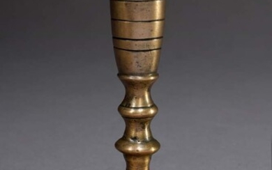 Gothic brass candlestick with three beads on a wide plate stand with perforated hole pattern, h. 11cm, restored, former coll. Walter Vonficht/Allgäu