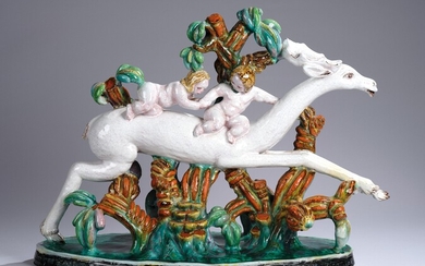 A large ceramic group: a fantastical stag with two putti, c. 1920/40
