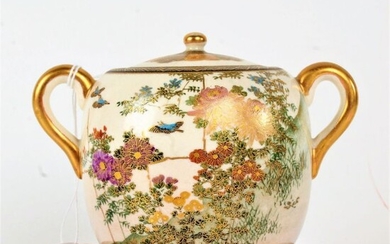 Japanese porcelain twin handled pot with cover, decorated with flowers and gilt handle either