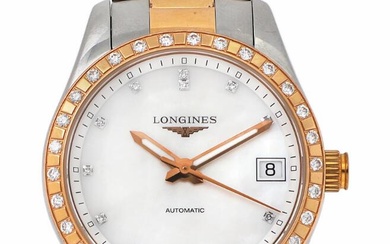 Longines A wristwatch of 18k gold and steel. Model Conquest Classic, ref....