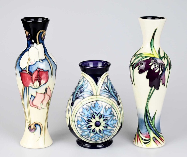 MOORCROFT; three pieces, including a limited edition baluster shaped example...