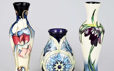 MOORCROFT; three pieces, including a limited edition baluster shaped example...