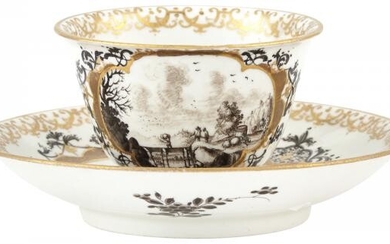 Meissen Porcelain Black and Gilt Decorated Teabowl and Saucer Circa 1725 With puce crossed swords.