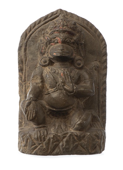 NEPAL - Mahakala en pierre grise agenouillé et les mains en abhaya varada mudra