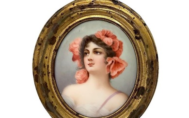 Oval miniature with a woman's face with orange flowers on her head.