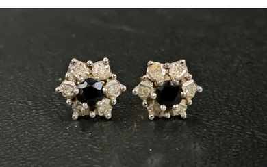 PAIR OF SAPPHIRE AND DIAMOND CLUSTER EARRINGS the central sa...