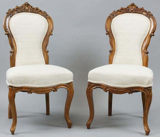 Pair of Victorian walnut rose carved side chairs