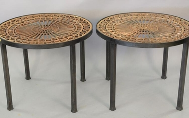 Pair of iron outdoor tables having Victorian wrought