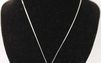 Pendentif en or gris (750) serti d'un diamant d'environ 0.75 ct. Poids brut : 1...