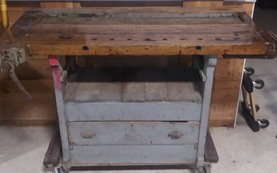 Primitive workbench in old paint with 2 vices