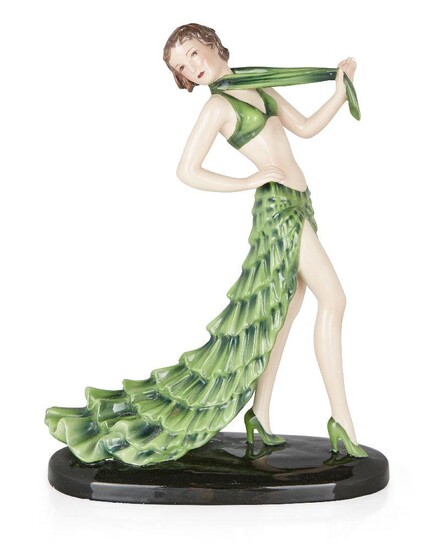 Stefan Dakon (1904-1992) for Goldscheider, 'Rumba' model of female dancer in green skirt and scarf, model no. 8302, circa 1938, Glazed ceramic, Impressed marks 'Goldscheider/Wien/MADE IN AUSTRIA/Dakon', and model numbers '8302/16/31', 32cm high...