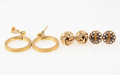 Three pairs of gold earrings.
