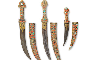 Trois dagues Ottomanes en acier damasquiné or serties de corail...