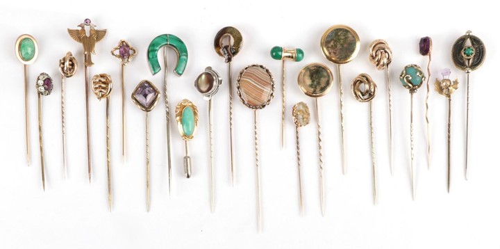 Twenty-Two Stick Pins, including a moss agate example, an amethyst...