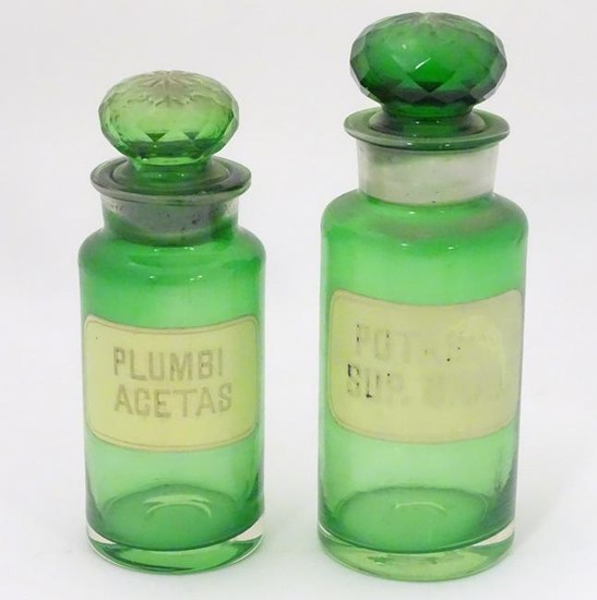 Two 20thC green glass pharmacy / chemist / apothecary