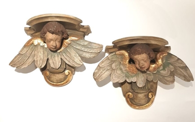 Two cherub heads