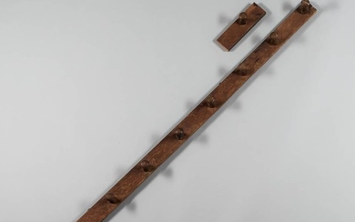 Oak and Chestnut Ten-peg Rack, 18th century, the oak back with turned pegs, (sawn in two pieces), longer section lg. 74 1/2, shorter se