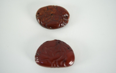 (2) CHINESE CARVED CHERRY AMBER DECORATIONS