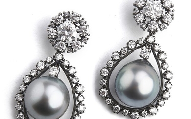 Hartmann's: A pair of Tahiti pearl and diamond ear pendants each set with a Tahiti pearl and diamonds, totalling app. 4.32 ct., mounted in 18k white gold. (2)
