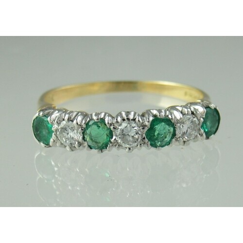 18ct gold emerald and diamond half eternity style ring of fo...