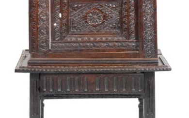 JACOBEAN CARVED OAK TABERNACLE ON STAND In two parts. Tabernacle door and moldings carved with stylized flowers and foliage. Stand w..