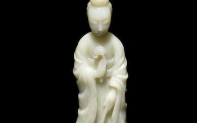A mottled pale green jade figure of a lady