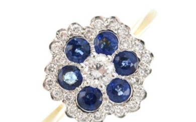 An 18ct gold diamond and sapphire cluster ring. The
