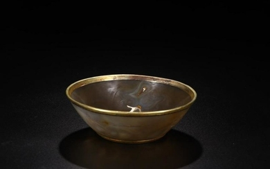 AN AGATE BOWL WRAPPED IN GOLD GILT EDGE