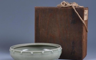 A Chinese Longquan celadon drum-shaped tripod censer
