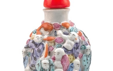 CHINESE MOLDED PORCELAIN SNUFF BOTTLE In spade shape, with relief lohan design. Four-character Qianlong mark on base. Height 2.9". G...
