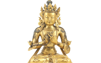 A gilt-bronze figure of Maitreya